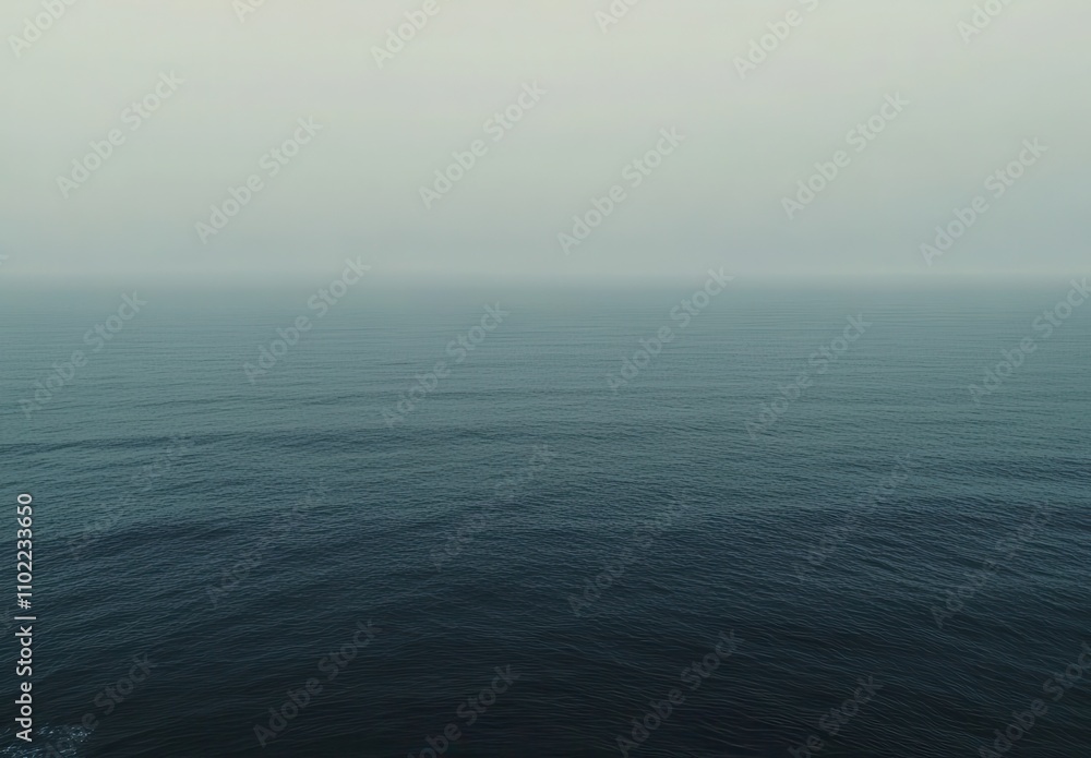 Tranquil Ocean Surface Under Soft Misty Sky at Dusk, Evoking Serenity and Calmness with Gentle Waves Reflecting Natural Beauty and Peaceful Atmosphere Tranquil Ocean Surface Under Soft Misty Sky at Dusk, Evoking Serenity and Calmness with Gentle Waves Reflecting Natural Beauty and Peaceful Atmosphere