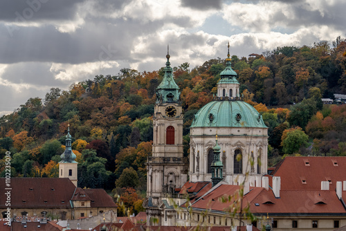 Prague's historical architecture, with the St Nicholas' baroque church towers and dome at Mala strana, offering a glimpse into the city's past.