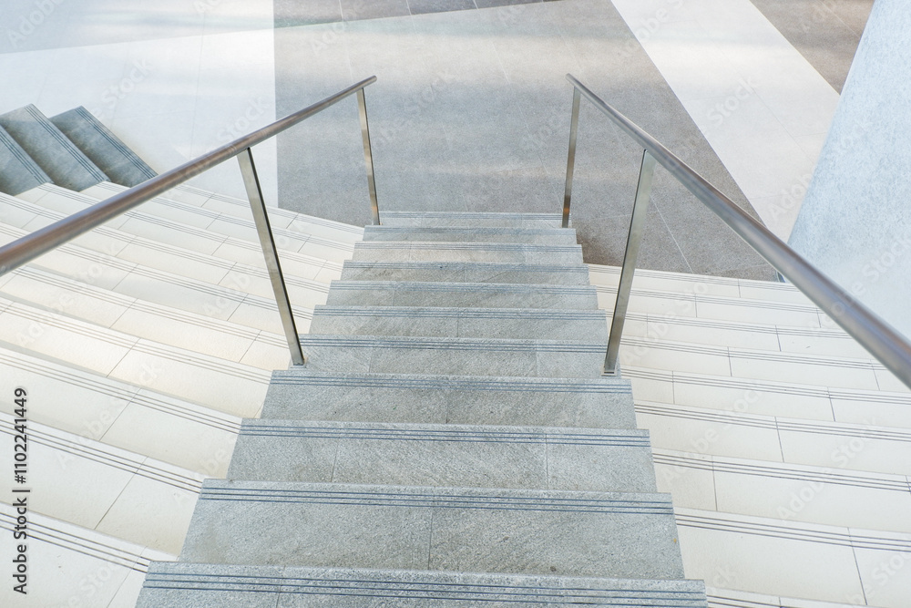 Modern Empty Long stair concrete in office building,Stairs from underground upward,Horizontal view of stairs in airport. Modern Empty Long stair concrete in office building,Stairs from underground upward,Horizontal view of stairs in airport.