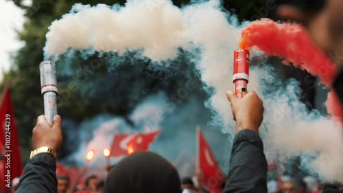 Colorful smoke bombs in action with Turkish fans waving flags, representing sports celebrations, social movements, protests, and dramatic visuals, emphasizing fandom and cultural pride