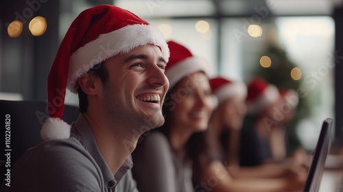 Office workers in Santa Claus's hats in the office. New Year's background. Merry Christmas greetings. The team is working. Corporate.