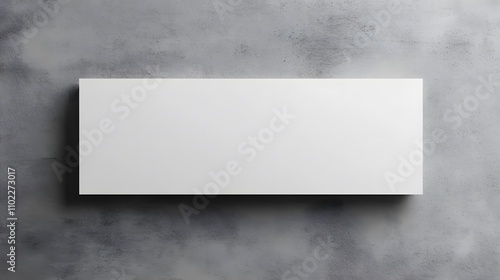 Blank white rectangular box on grey textured background.