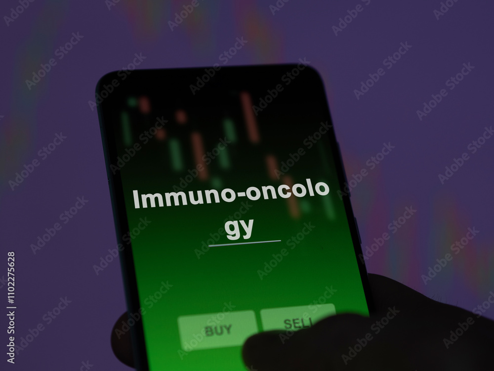 An investor analyzing the immuno-oncology etf fund on a screen. A phone shows the prices of Immuno-oncology An investor analyzing the immuno-oncology etf fund on a screen. A phone shows the prices of Immuno-oncology