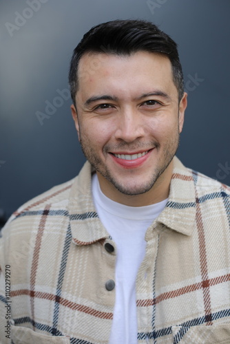 Handsome ethnic man wearing a plaid shirt 