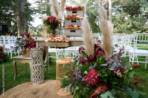 Elegant outdoor wedding decor with floral and rustic elements photo