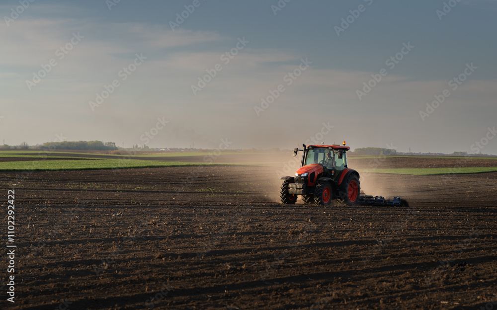 Tractor preparing the land for a new crop planting Tractor preparing the land for a new crop planting