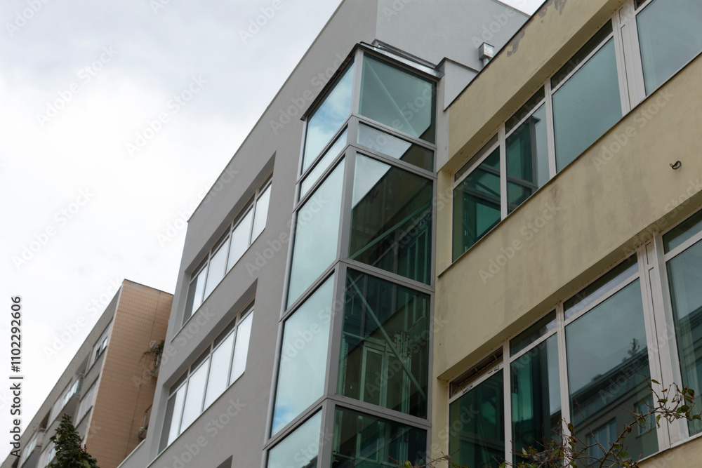 This is a structure featuring an abundance of windows integrated into its design, allowing for ample natural light to illuminate the interior This is a structure featuring an abundance of windows integrated into its design, allowing for ample natural light to illuminate the interior