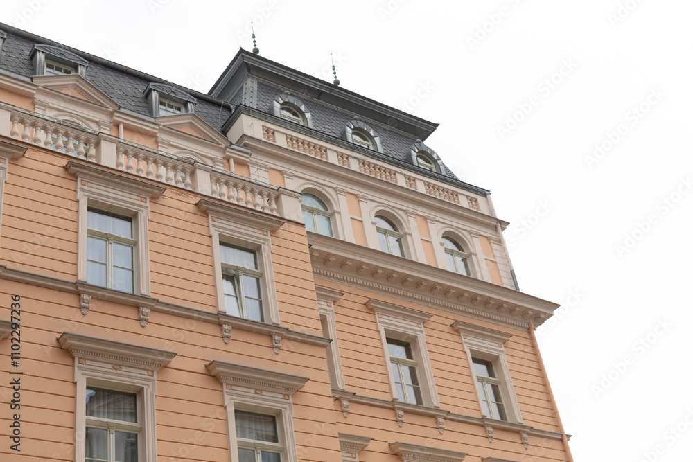 There is a large and impressive building that features a beautiful balcony located at the very top of its structure and design There is a large and impressive building that features a beautiful balcony located at the very top of its structure and design