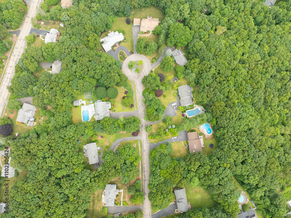 Aerial view of Suburban neighborhood in Sharon, Norfolk County, Massachusetts, with green forest and big villa.