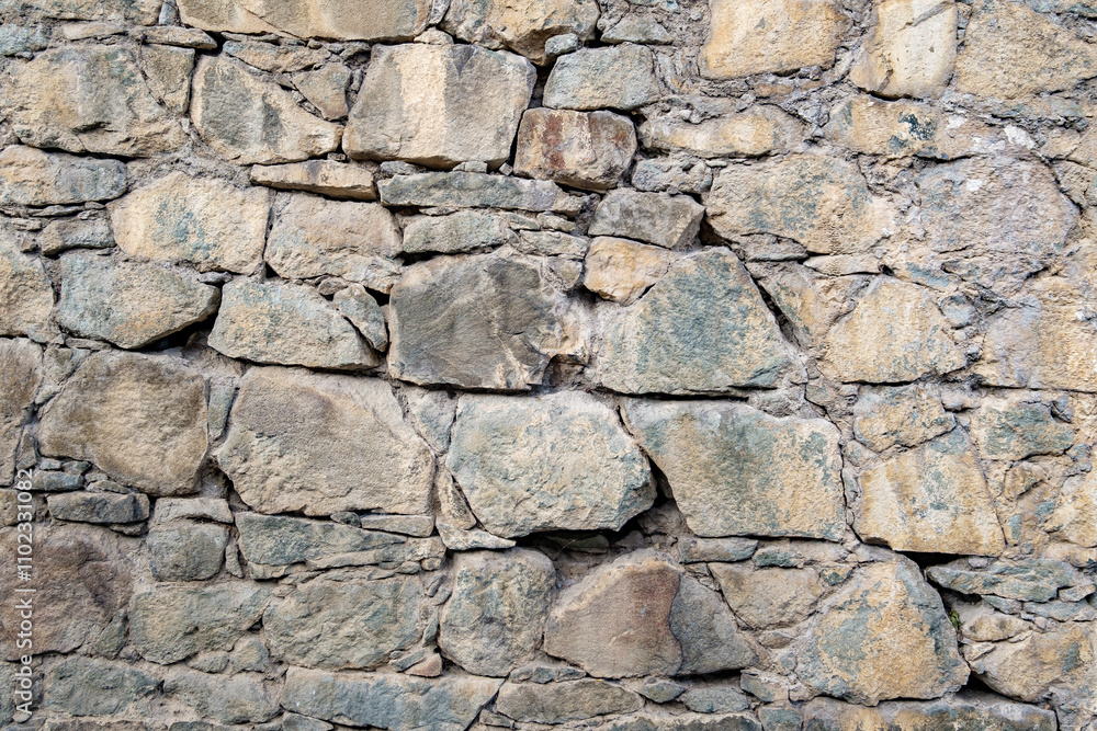 old wall lined with large uneven stones old wall lined with large uneven stones