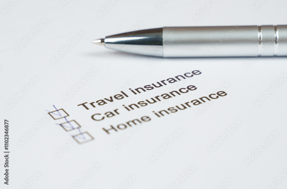 Essential insurance checklist with a silver pen for planning protection Essential insurance checklist with a silver pen for planning protection