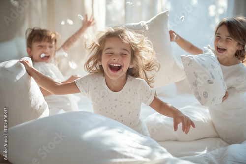A group of giggling children having a pillow fight in a brightly lit, cozy bedroom