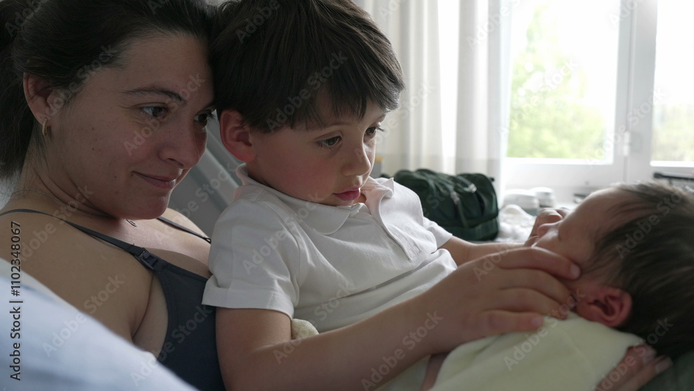 Mother and older sibling gently admiring newborn baby in hospital bed. family moment emphasizes the warmth and connection between siblings and the loving care Mother and older sibling gently admiring newborn baby in hospital bed. family moment emphasizes the warmth and connection between siblings and the loving care