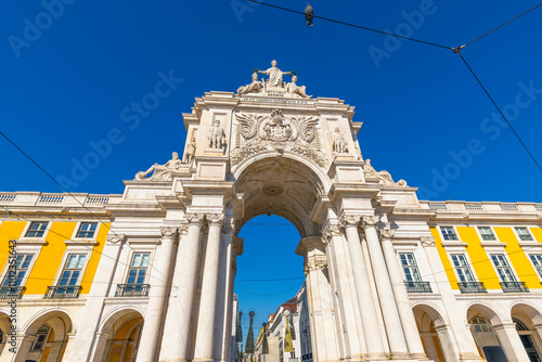 The historic Arco da Rua Augusta arch on Praça do Comércio square in the Baixa city center district of Lisbon, Portugal. photo