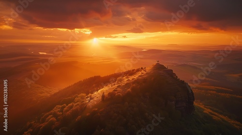 A breathtaking sunset illuminating mountain peaks with vibrant colors, casting long shadows and creating a serene atmosphere. 