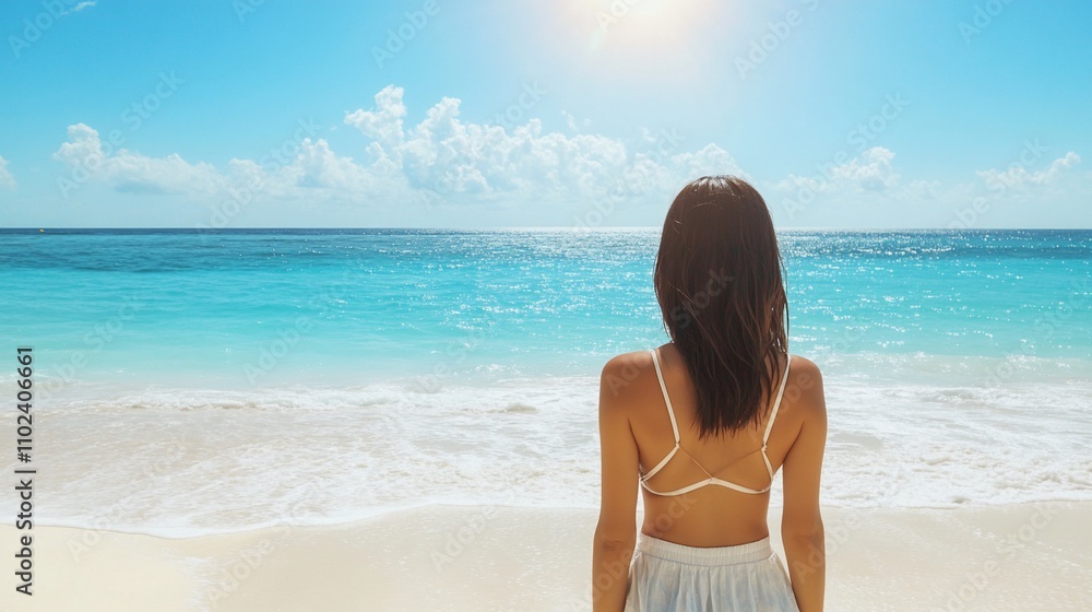 Woman on a tropical beach looking at ocean. Woman on a tropical beach looking at ocean.