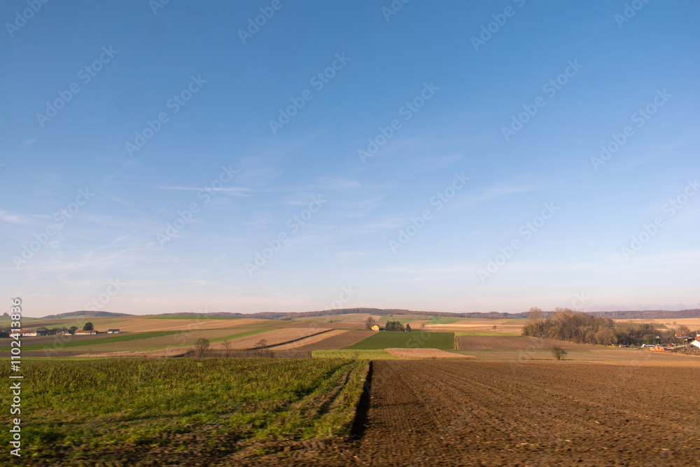 Autumn landscape in the countryside. Agricultural field and blue sky. Autumn landscape in the countryside. Agricultural field and blue sky.