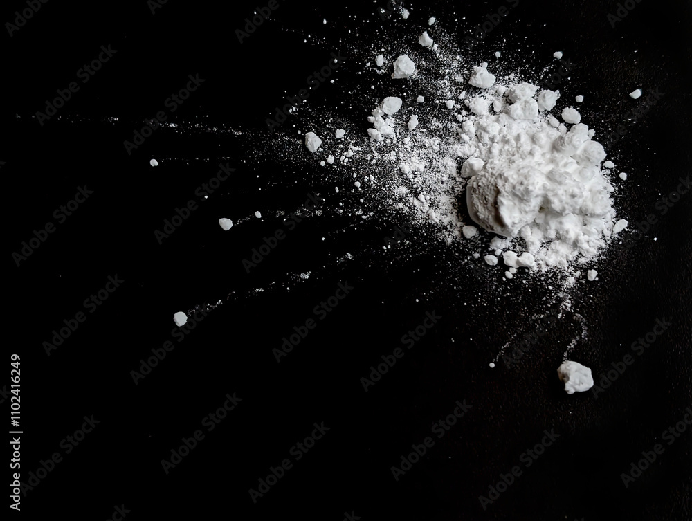Splash of white powder on a black background. Copy space Splash of white powder on a black background. Copy space