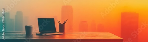 Stylish workspace with laptop and coffee cup overlooking urban skyline at sunset