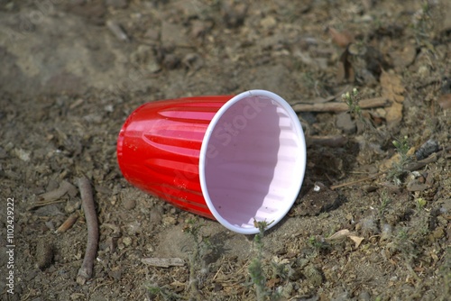 red solo cup on dirt ground