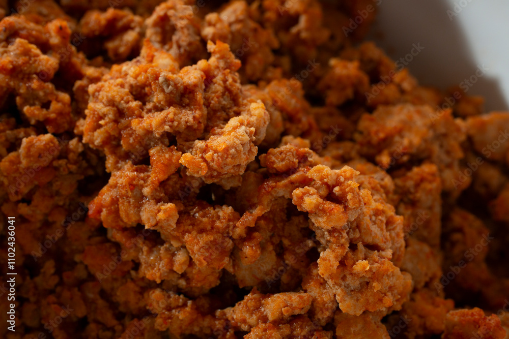 A closeup view of a taco style ground chicken. A closeup view of a taco style ground chicken.