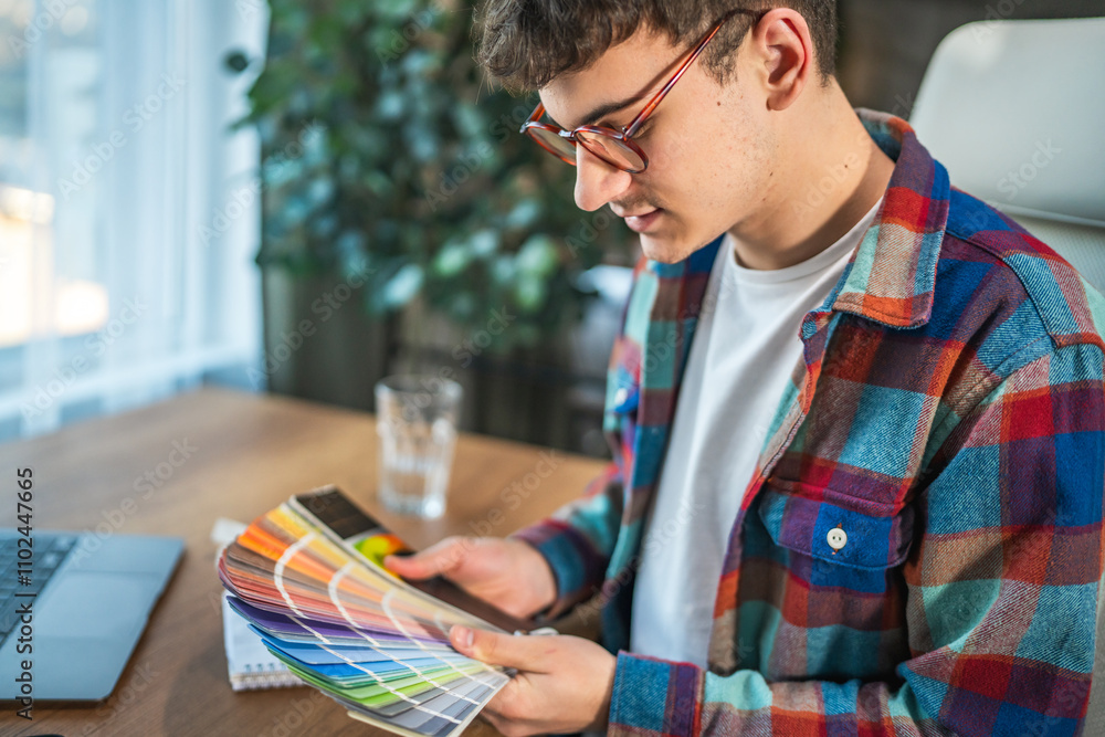 adult man designer architect hold color palette and chose paint design adult man designer architect hold color palette and chose paint design