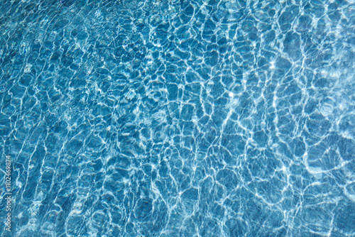 Blue water background. Swimming Pool. Pool edge.