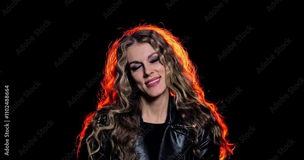 A Confident Female Model with Beautiful Wavy Hair Posing Gracefully Against a Black Background A Confident Female Model with Beautiful Wavy Hair Posing Gracefully Against a Black Background