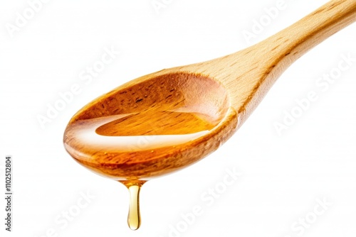 Glossy Honey Dripping from Wooden Spoon on White Background photo