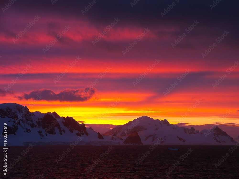 Stunning Antarctic Sunset Over Icy Mountains