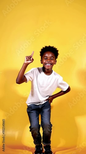 A young boy dancing with joy, giving an enthusiastic 