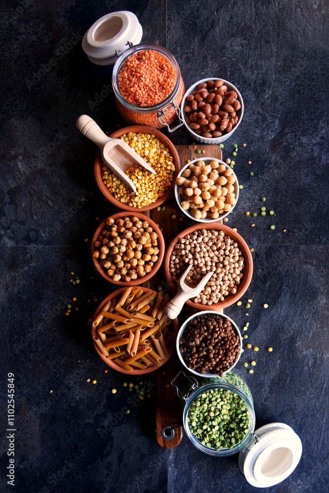 Selection of dried and canned legumes, and pasta made from legumes for plant-based whole food diet. Selection of dried and canned legumes, and pasta made from legumes for plant-based whole food diet.
