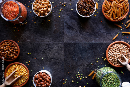 Selection of dried and canned legumes, and pasta made from legumes for plant-based whole food diet.