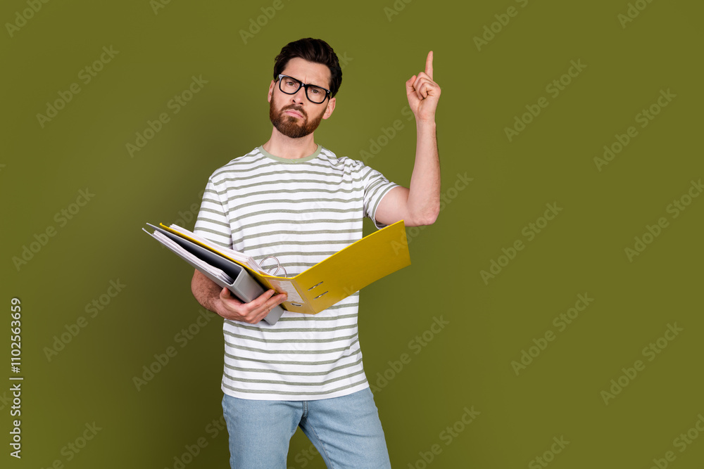 Photo of handsome successful boss man wear stylish clothes finger up isolated on khaki color background Photo of handsome successful boss man wear stylish clothes finger up isolated on khaki color background