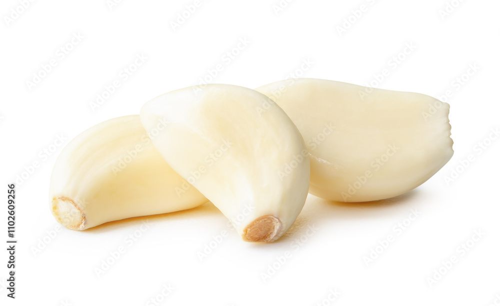 Side view of peeled garlic cloves in stack isolated on white background with clipping path Side view of peeled garlic cloves in stack isolated on white background with clipping path