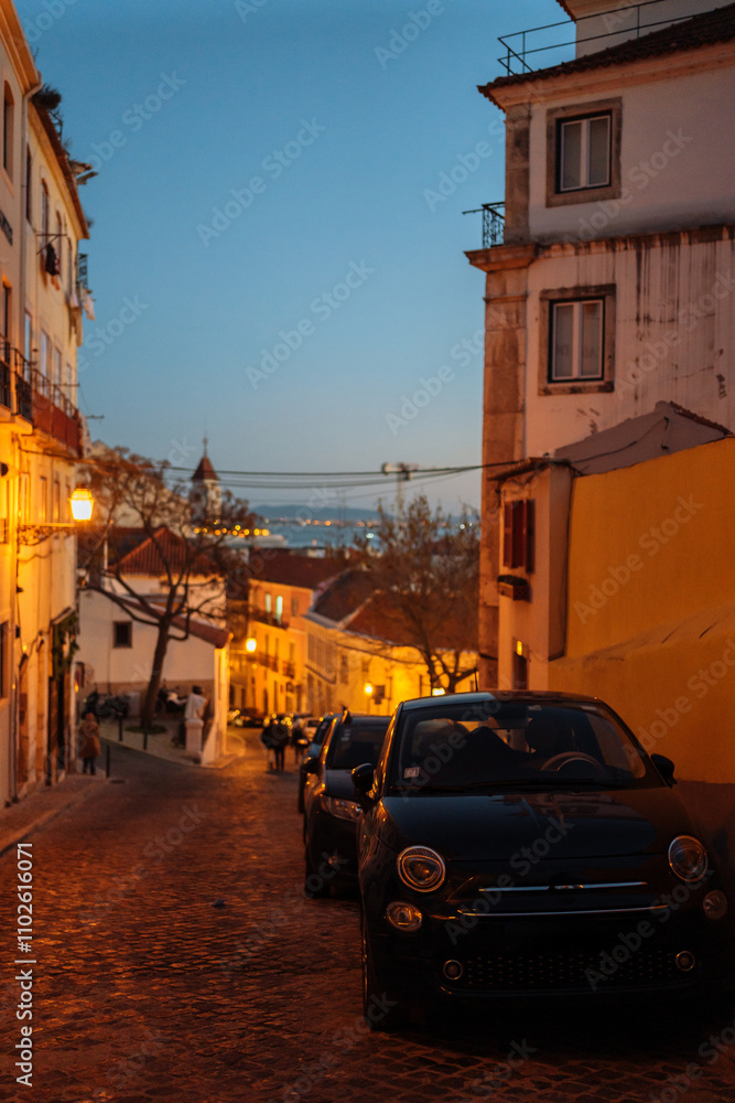 Evening street view in a historic neighborhood with vintage cars parked Evening street view in a historic neighborhood with vintage cars parked