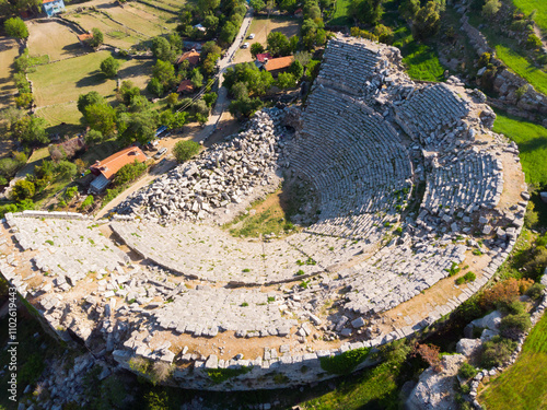 Scenic aerial view of remains of antique Roman theater of ancient city of Selge in Altinkaya village, Antalya province on sunny spring day, Turkey photo