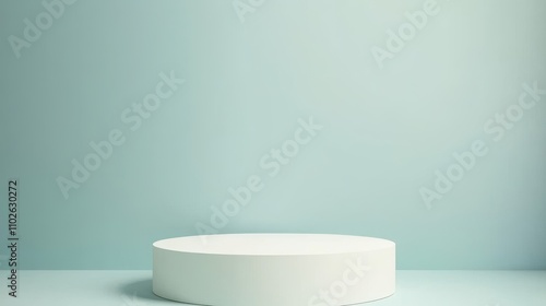 White cylindrical platform against a light blue background