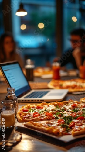 Late-night work session with pizza and laptops: cozy cafe ambiance, warm lighting, and delicious food fuel productivity and collaboration into the evening hours.