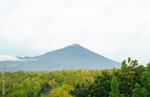 view of Mount Ciremai in West Java and cloudy sky and photo of a lying cellphone, old television antenna photo