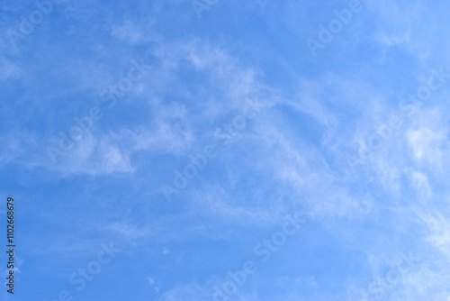 beautiful blue sky and white fluffy group of clouds with sunrise in the morning, natural background