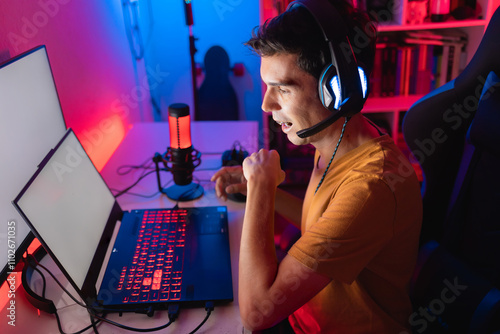 Obraz na plátně Gamer playing an online multiplayer game on a gaming laptop