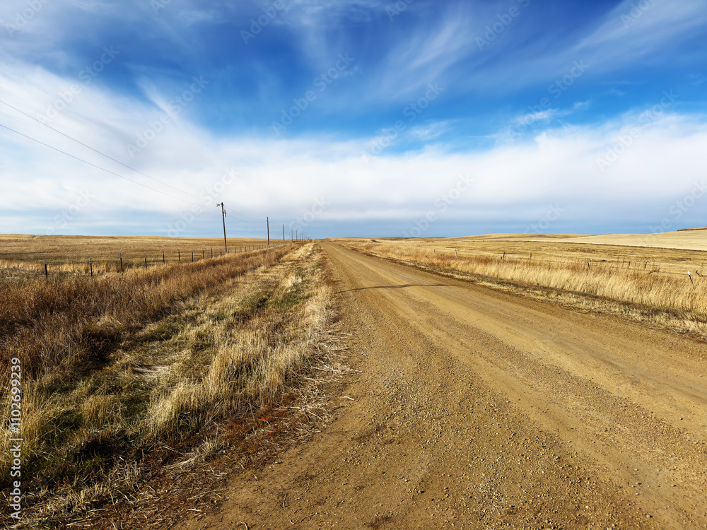 A dirt road leads to the North Dakota horizon