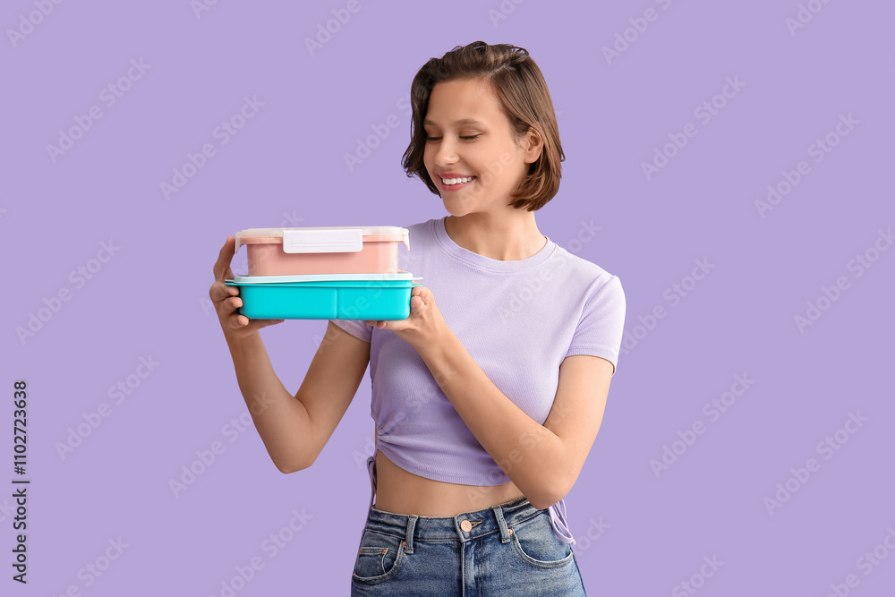 Beautiful young happy woman with lunchboxes of tasty food on purple background Beautiful young happy woman with lunchboxes of tasty food on purple background