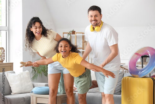 Happy family with packed su...