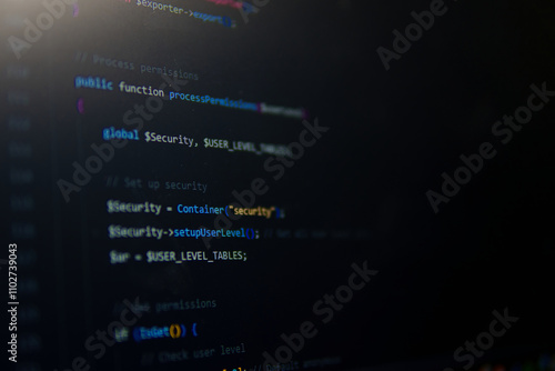 Cybersecurity Code: Close-up shot of a computer screen displaying lines of complex code, with a focus on cybersecurity functions.