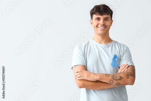 Young man with blue ribbon ...