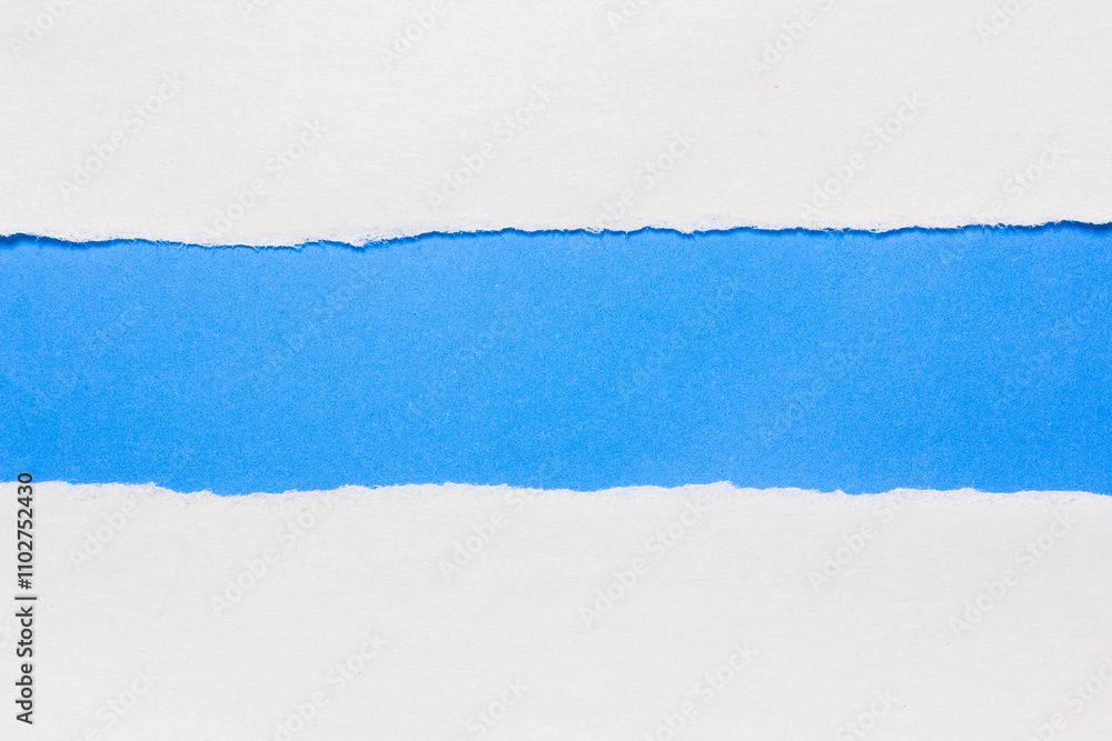 Torn paper on a blue background Torn paper on a blue background