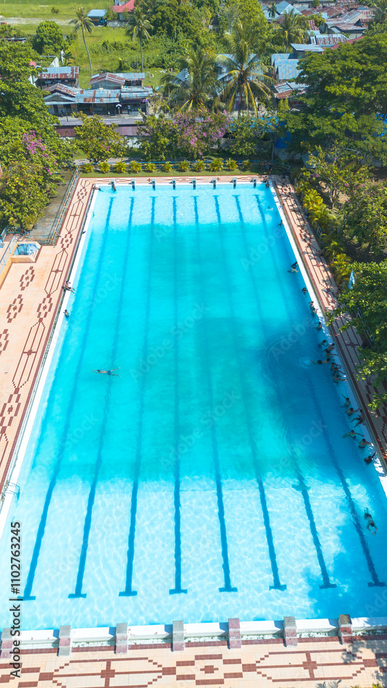 Top view of swimming pool with blue water