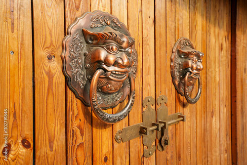 Wooden door and door knocker of folk houses in Taiwan scenic spot of China Ethnic Museum in Beijing